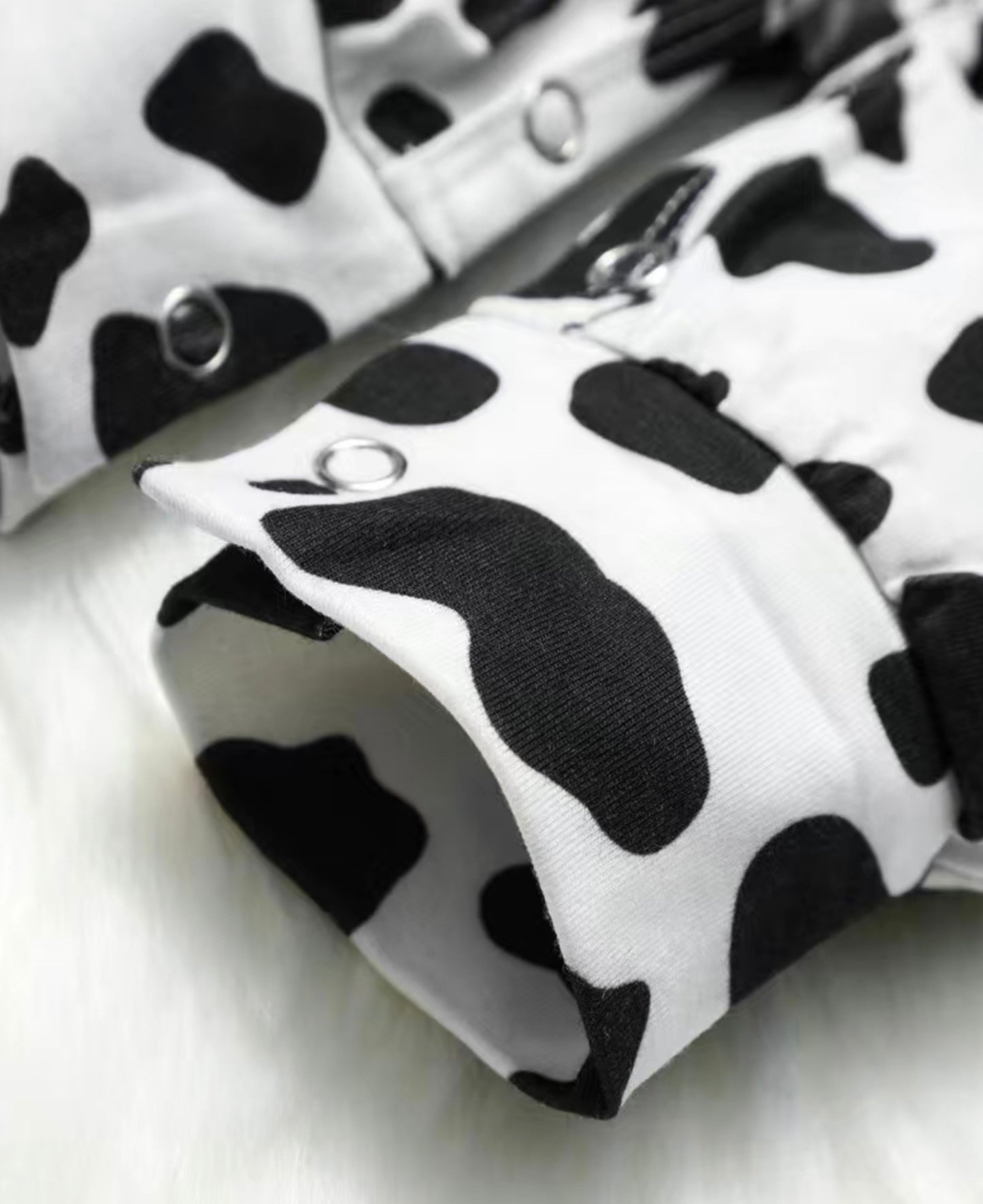 Button Me In Cow Print Romper